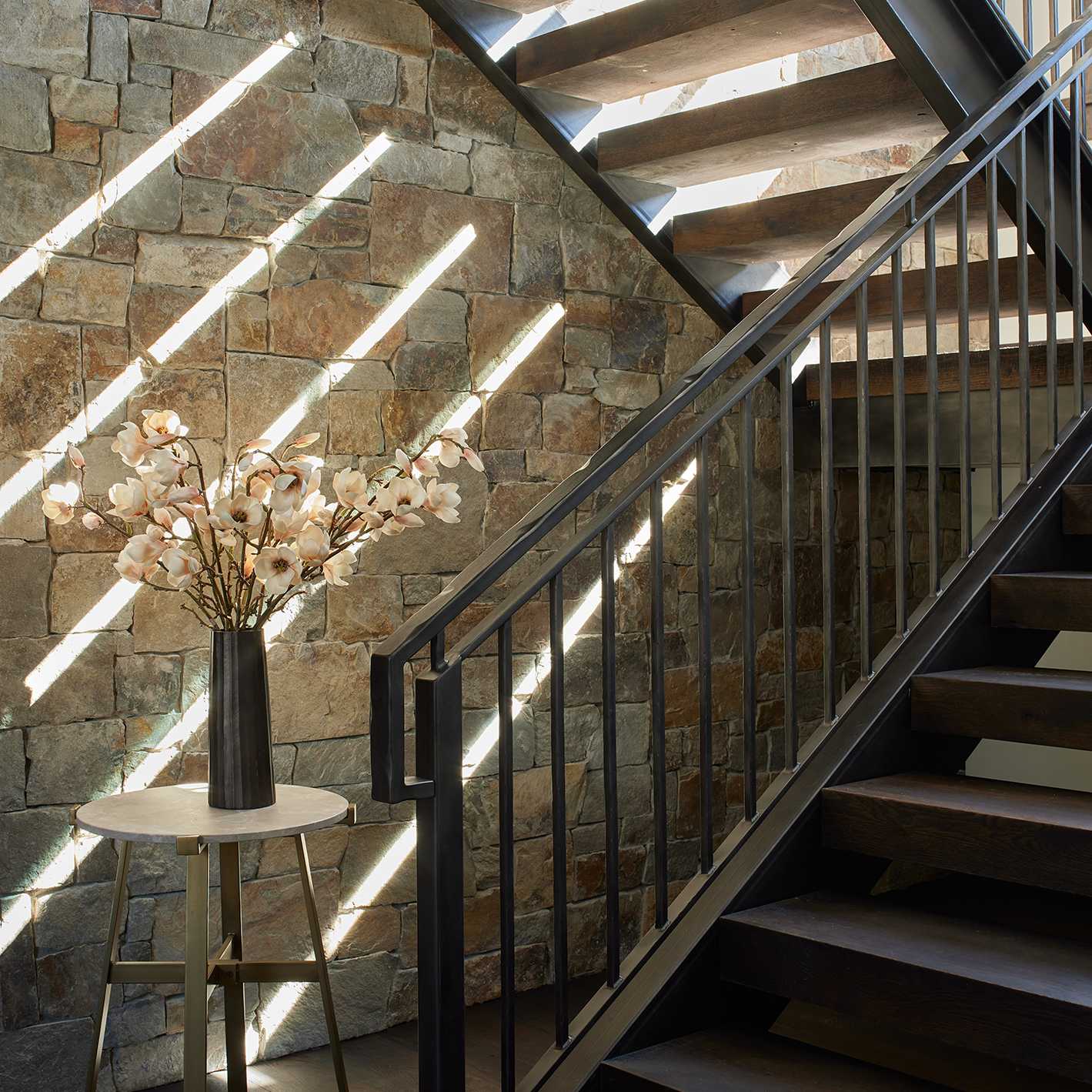 Jackson Hole Interior Design vignette of staircase and stone accent wall